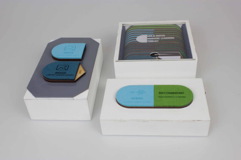 The two toolkits (one in normal mode and one in compare modus) with the storage box for the tokens
